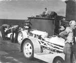 Flight deck crew with tractors aboard Enterprise CV-6, 1945.