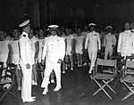 Vice Admiral Halsey escorts Lord Mountbatten to a movie in Enterprise CV-6's hangar, 25 Sep. 1941.