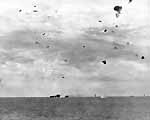 The first of two near misses explodes off Enterprise CV-6's port quarter, 20 March 1945.