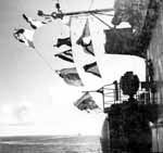 Signal flags flutter from Enterprise CV-6's bridge, 13 November 1942.