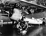 Aviation Metalsmiths aboard Enterprise CV-6 assemble a plane, October 1941.