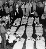 Wounded men await transfer in hangar deck of Enterprise CV-6, October 1942.