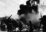 Scene on Enterprise CV-6, after being struck by friendly fire and enemy near misses, March 1945.