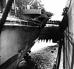 Enterprise's hull again feels salt water after nearly two months in dry dock, early August 1945.