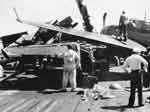 Closeup of plane damaged by a flight deck crash, 11 February 1945.