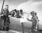 VB-10's LT Oliver W. Hubbard and Radioman Jack Glass prepare for a mission against Truk Atoll.