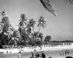 Men from the Big E and Air Group 10 line up for beer at Majuro Atoll, 1 March 1944.