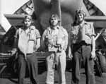 LT(jg) C B Collins (center) and his VT-10 air crew, in spring 1944.