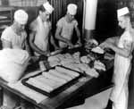 Enterprise CV-6 bakers rolling loaves of bread.