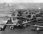 Bombing Six SBD-2s warm up on Enterprise's flight deck, preparing to strike Wake Island.