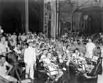 Enterprise CV-6's ship's band prepares to perform in the hangar deck, 25 September 1941.