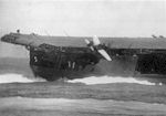 An SBD Dauntless topples off Enterprise's flight deck during the Battle of Santa Cruz.