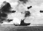 A Japanese aerial torpedo slams against Yorktown CV-5's side, 4 June 1942.