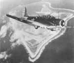 An Enterprise CV-6 torpedo bomber over Wake Island, 24 February 1942.