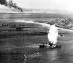 A Japanese freighter in Truk Atoll is hit by torpedo dropped from a VT-10 Avenger, 17 February 1944.