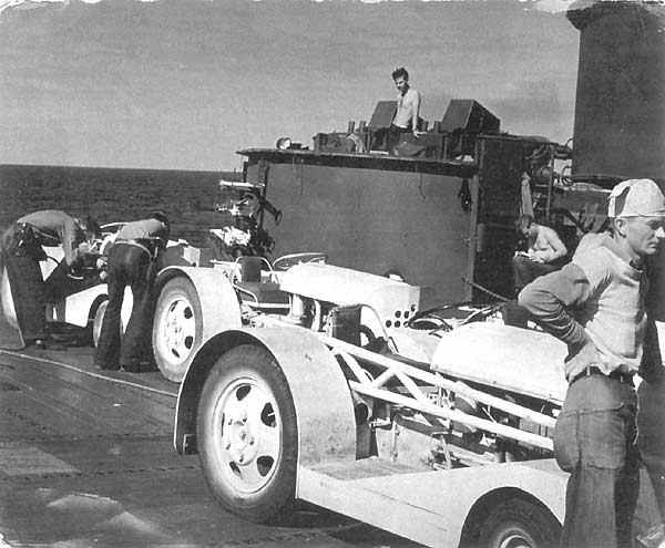 Flight deck crew with tractors aboard Enterprise CV-6, 1945.