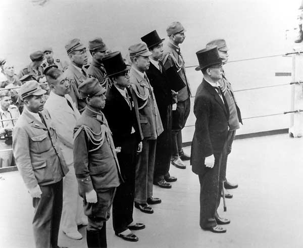 The Japanese surrender delegation aboard USS Missouri BB-63 in Tokyo Bay, 2 September 1945.