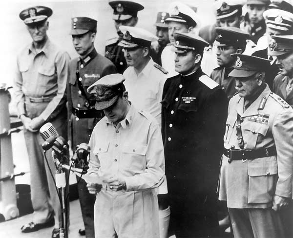 General Douglas MacArthur reads closing remarks at the Japanese surrender ceremony.