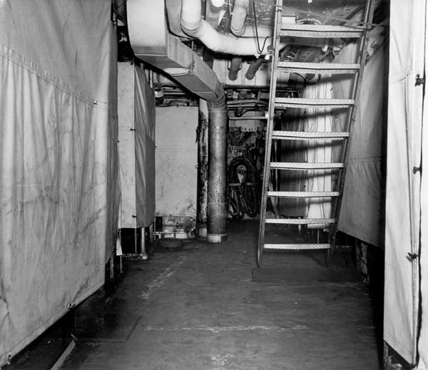 Tents form mens' quarters below decks in Enterprise CV-6, November 1942.