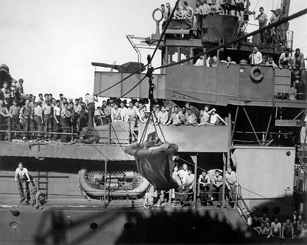 LCDR William I. Martin is returned to Enterprise, after being shot down over Saipan, June 1944.