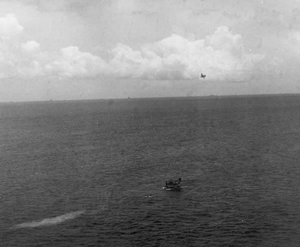 A Vought OS2U Kingfisher picks up two US Navy airmen downed off Truk, 30 April 1944.