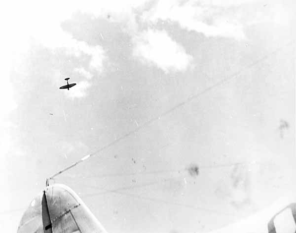 A Japanese dive bomber hurtles low over the Big E after releasing its bomb, 26 October 1942.