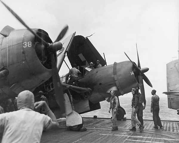 Pilots and crewmen leave planes after returning from a strike against Formosa, 12-13 October 1944.