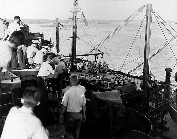 Men aboard Enterprise CV-6 enjoy a concert by Guadalupe AO-32's ship's band, December 1942.