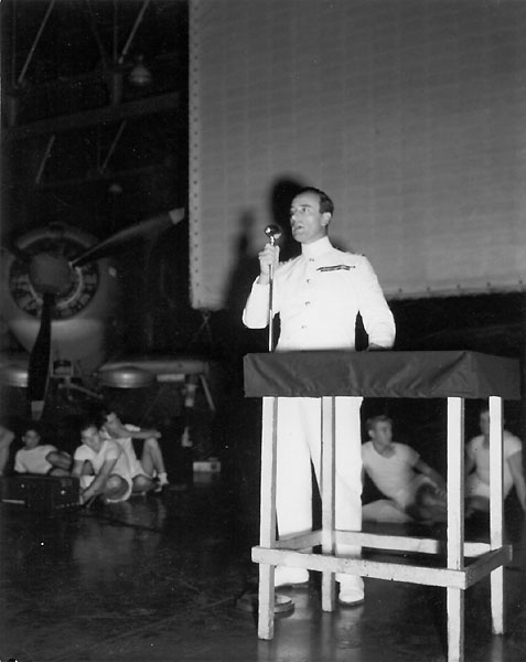 Lord Louis Mountbatten addresses Enterprise CV-6's men and officers before viewing a movie.