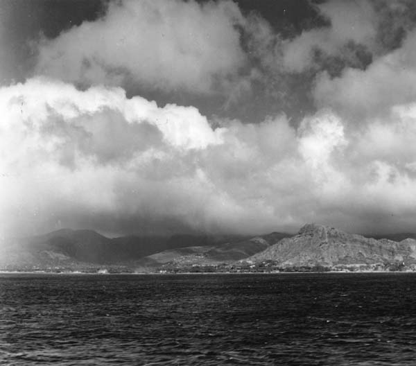 Diamond Head, Hawaii, as seen from Enterprise CV-6 as she enters Pearl Harbor for the last time.