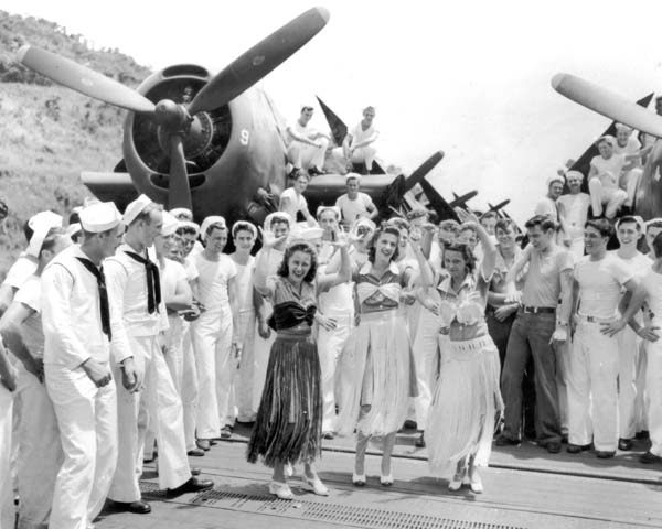 Hula girls entertain the crew of the Big E, as they pass through the Panama Canal, October 1945.