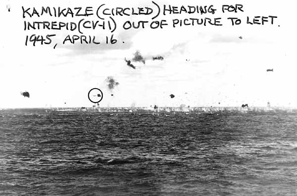 Kamikaze (circled) approaches Intrepid CV-11 (off left edge of photo), 16 April 1945.