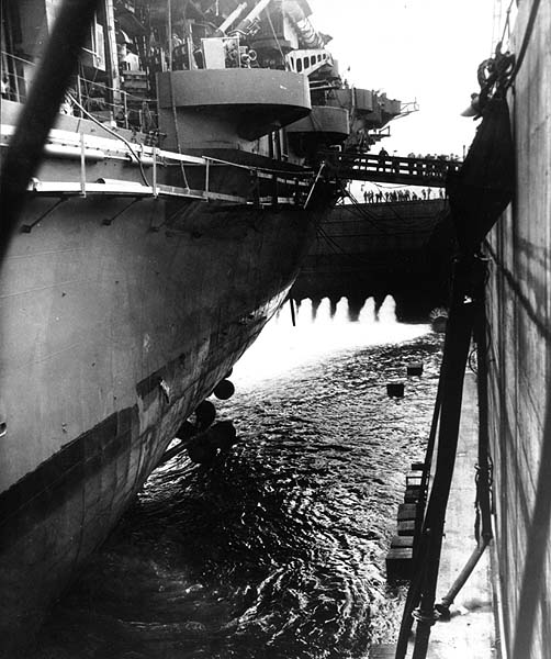 Enterprise's hull again feels salt water after nearly two months in dry dock, early August 1945.