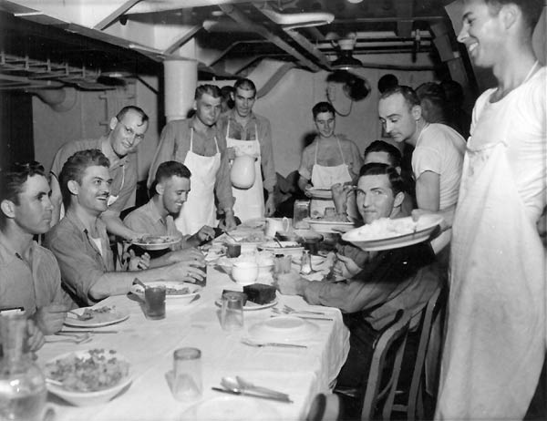 Pollywog chiefs wait tables and serve the shellbacks: pollywog initiation, 22 January 1944.