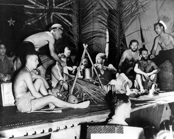 Men of the HMNZS Leander present a Happy Hour variety show for the Big E, 21 April 1943.