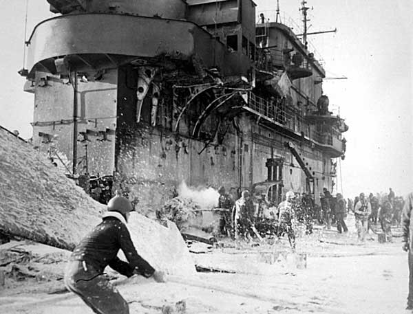 Fire-fighting foam lies thickly over the Big E's flight deck, 20 March 1945.