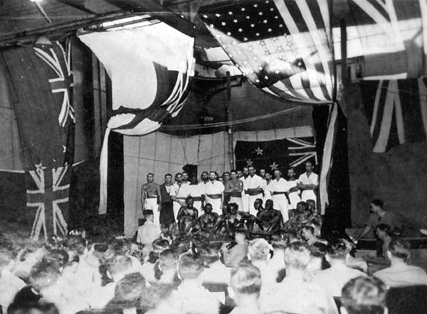 A company of performers from HMNZS Leander sings their final chorus.