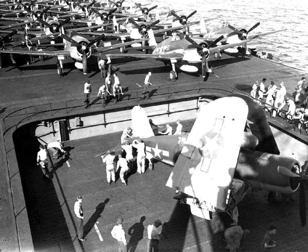 A VF(N)-101 F4U-2(N) Corsair night fighter on Enterprise CV-6's No. 2 elevator, 20 January 1944.