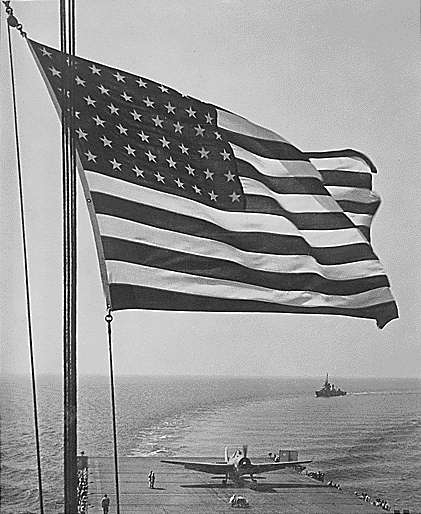 Stars and Stripes over Enterprise CV-6 in November 1942.