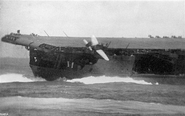 An SBD Dauntless topples off Enterprise's flight deck during the Battle of Santa Cruz.