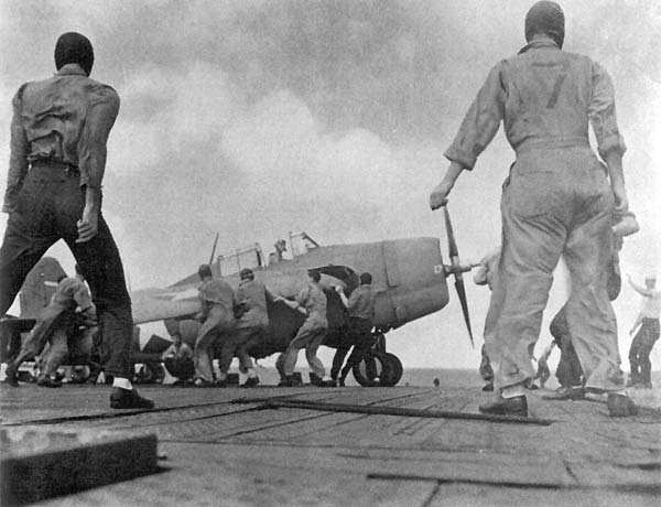 A VF-10 Wildcat fighter is prepared for launch from Enterprise CV-6, 24 October 1942.