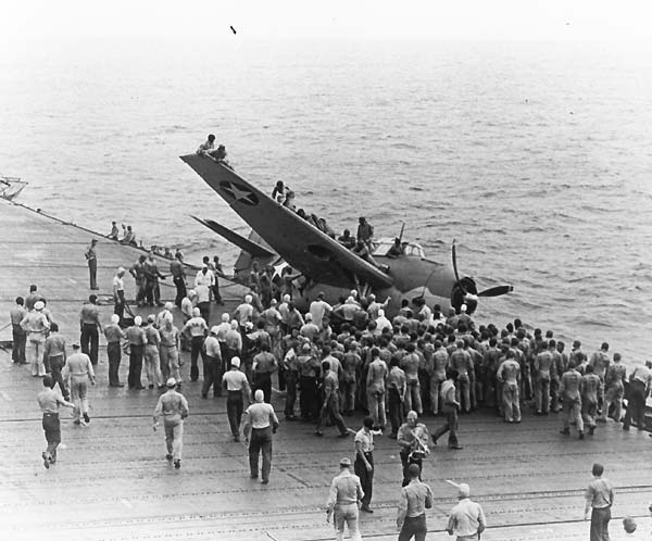 A TBF Avenger rests precariously on Enterprise's port catwalk, 8 July 1942.